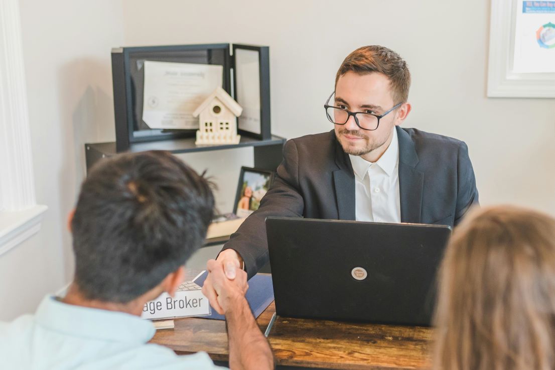 real estate agent closing a deal with a client